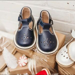 Black leather t-strap shoes